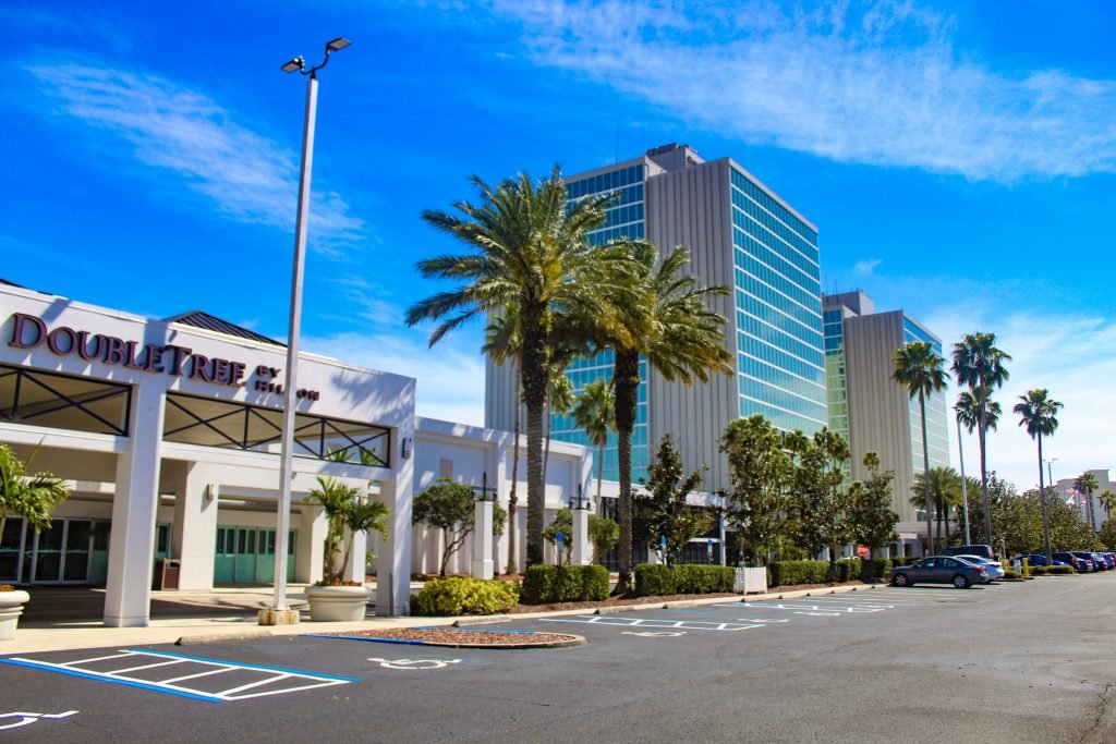 DoubleTree by Hilton at the Entrance to Universal Orlando — hotel exterior with palm trees